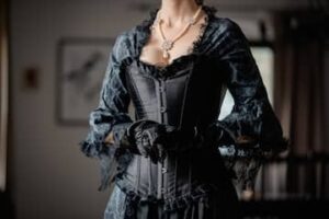 Structured basque waist corset gown with defined waist and vintage-inspired silhouette
